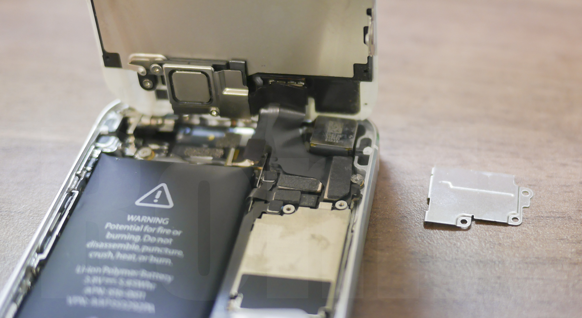 iPhone 5 Battery replacement: display connector cover is removed